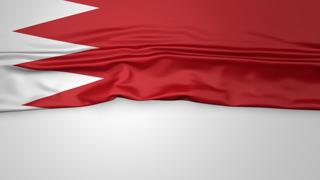 Bahrain National Flag, Flag folded in half and placed on white paper