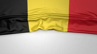 Belgium National Flag, Flag folded in half and placed on white paper