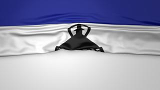 Lesotho National Flag, Flag folded in half and placed on white paper