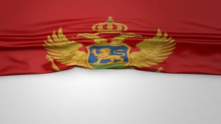 Montenegro National Flag, Flag folded in half and placed on white paper