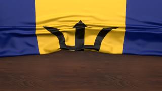 Barbados National Flag, Flag folded in half and placed on wood desk