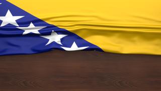 Bosnia-and-Herzegovina National Flag, Flag folded in half and placed on wood desk