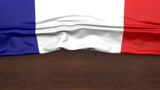 France National Flag, Flag folded in half and placed on wood desk