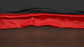 Germany National Flag, Flag folded in half and placed on wood desk