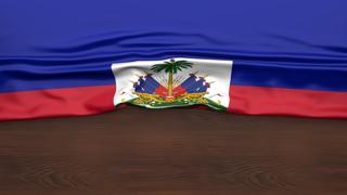 Haiti National Flag, Flag folded in half and placed on wood desk