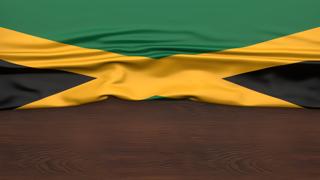 Jamaica National Flag, Flag folded in half and placed on wood desk