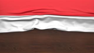 Luxembourg National Flag, Flag folded in half and placed on wood desk