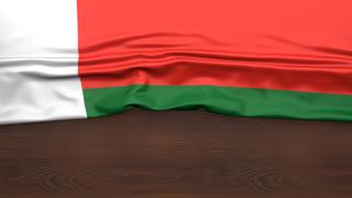 Madagascar National Flag, Flag folded in half and placed on wood desk