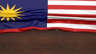 Malaysia National Flag, Flag folded in half and placed on wood desk