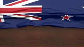 New-Zealand National Flag, Flag folded in half and placed on wood desk