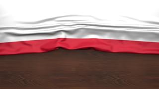 Poland National Flag, Flag folded in half and placed on wood desk