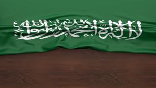 Saudi-Arabia National Flag, Flag folded in half and placed on wood desk