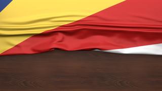 Seychelles National Flag, Flag folded in half and placed on wood desk