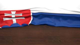 Slovakia National Flag, Flag folded in half and placed on wood desk