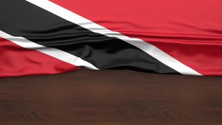 Trinidad-and-Tobago National Flag, Flag folded in half and placed on wood desk