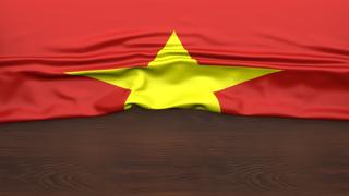 Vietnam National Flag, Flag folded in half and placed on wood desk