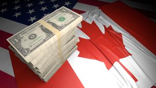 Canada National Flag, American dollars and flag placed on top of the American flag