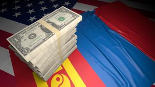 Mongolia National Flag, American dollars and flag placed on top of the American flag