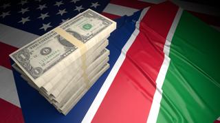 Namibia National Flag, American dollars and flag placed on top of the American flag