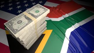 Republic-of-South-Africa National Flag, American dollars and flag placed on top of the American flag