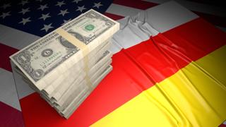 South-Ossetia National Flag, American dollars and flag placed on top of the American flag