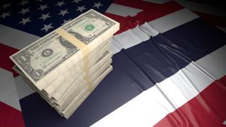 Thailand National Flag, American dollars and flag placed on top of the American flag