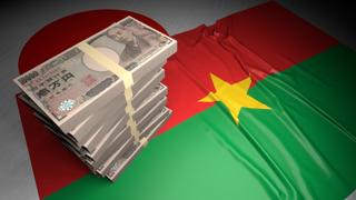 Burkina-Faso National Flag, Japanese yen and national flag placed on top of the Japanese flag