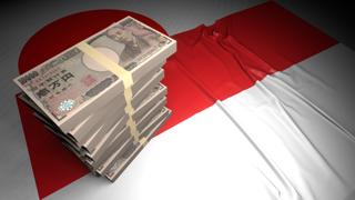 Indonesia National Flag, Japanese yen and national flag placed on top of the Japanese flag