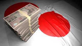 Japan National Flag, Japanese yen and national flag placed on top of the Japanese flag