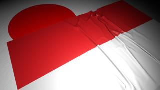 Indonesia National Flag, The national flag placed on top of the Japanese flag on a desk in a dark space