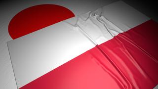 Poland National Flag, The national flag placed on top of the Japanese flag on a desk in a dark space