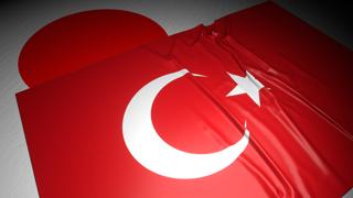 Turkiye National Flag, The national flag placed on top of the Japanese flag on a desk in a dark space