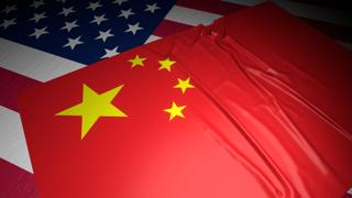 China National Flag, A flag placed on top of an American flag on a desk in a dark space