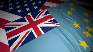 Tuvalu National Flag, A flag placed on top of an American flag on a desk in a dark space