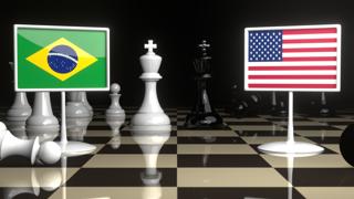 Brazil National Flag, Flag placed on a chessboard with the American flag in the background