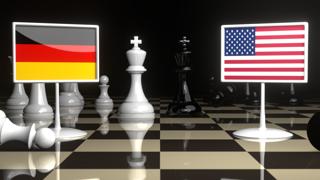 Germany National Flag, Flag placed on a chessboard with the American flag in the background