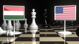 Hungary National Flag, Flag placed on a chessboard with the American flag in the background