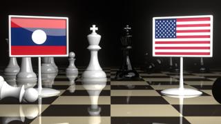 Laos National Flag, Flag placed on a chessboard with the American flag in the background