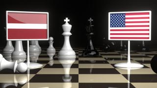 Latvia National Flag, Flag placed on a chessboard with the American flag in the background