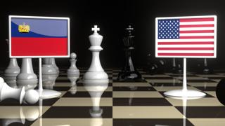 Liechtenstein National Flag, Flag placed on a chessboard with the American flag in the background