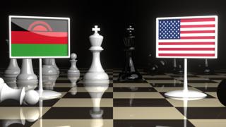 Malawi National Flag, Flag placed on a chessboard with the American flag in the background