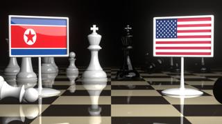 North-Korea National Flag, Flag placed on a chessboard with the American flag in the background