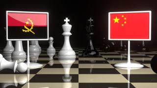 Angola National Flag, The national flag on a chessboard with the Japanese flag in the background