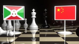 Burundi National Flag, The national flag on a chessboard with the Japanese flag in the background