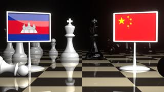 Cambodia National Flag, The national flag on a chessboard with the Japanese flag in the background