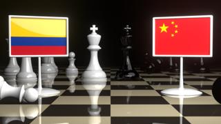 Colombia National Flag, The national flag on a chessboard with the Japanese flag in the background