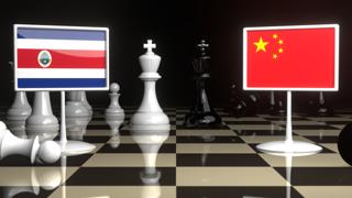 Costa-Rica National Flag, The national flag on a chessboard with the Japanese flag in the background