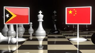 East-Timor National Flag, The national flag on a chessboard with the Japanese flag in the background