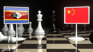 Eswatini National Flag, The national flag on a chessboard with the Japanese flag in the background