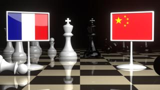 France National Flag, The national flag on a chessboard with the Japanese flag in the background